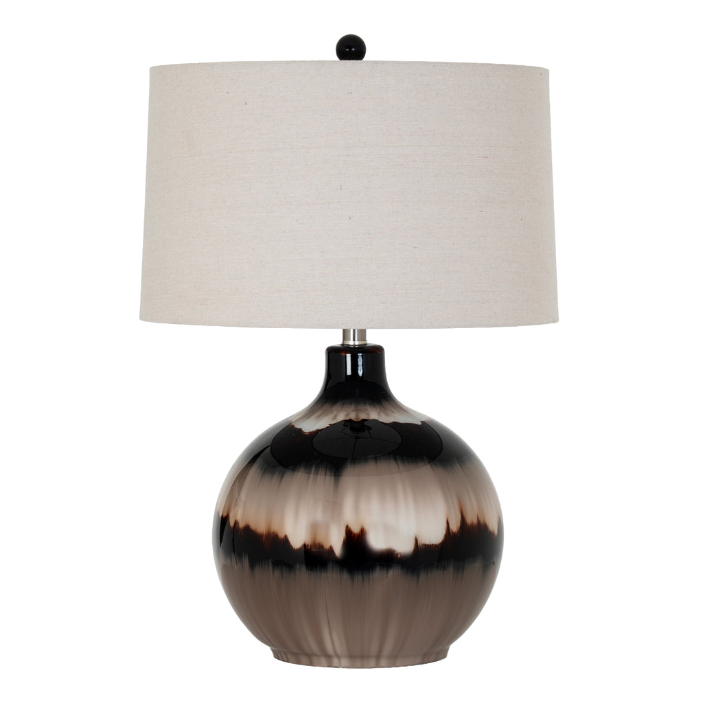 Table lamp with a black and brown ceramic base and a white lampshade on a white background