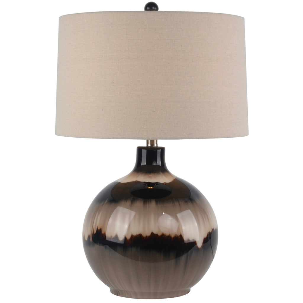 Table lamp with a ceramic base and beige fabric shade on a white background