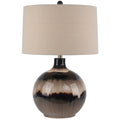 Table lamp with a ceramic base and beige fabric shade on a white background