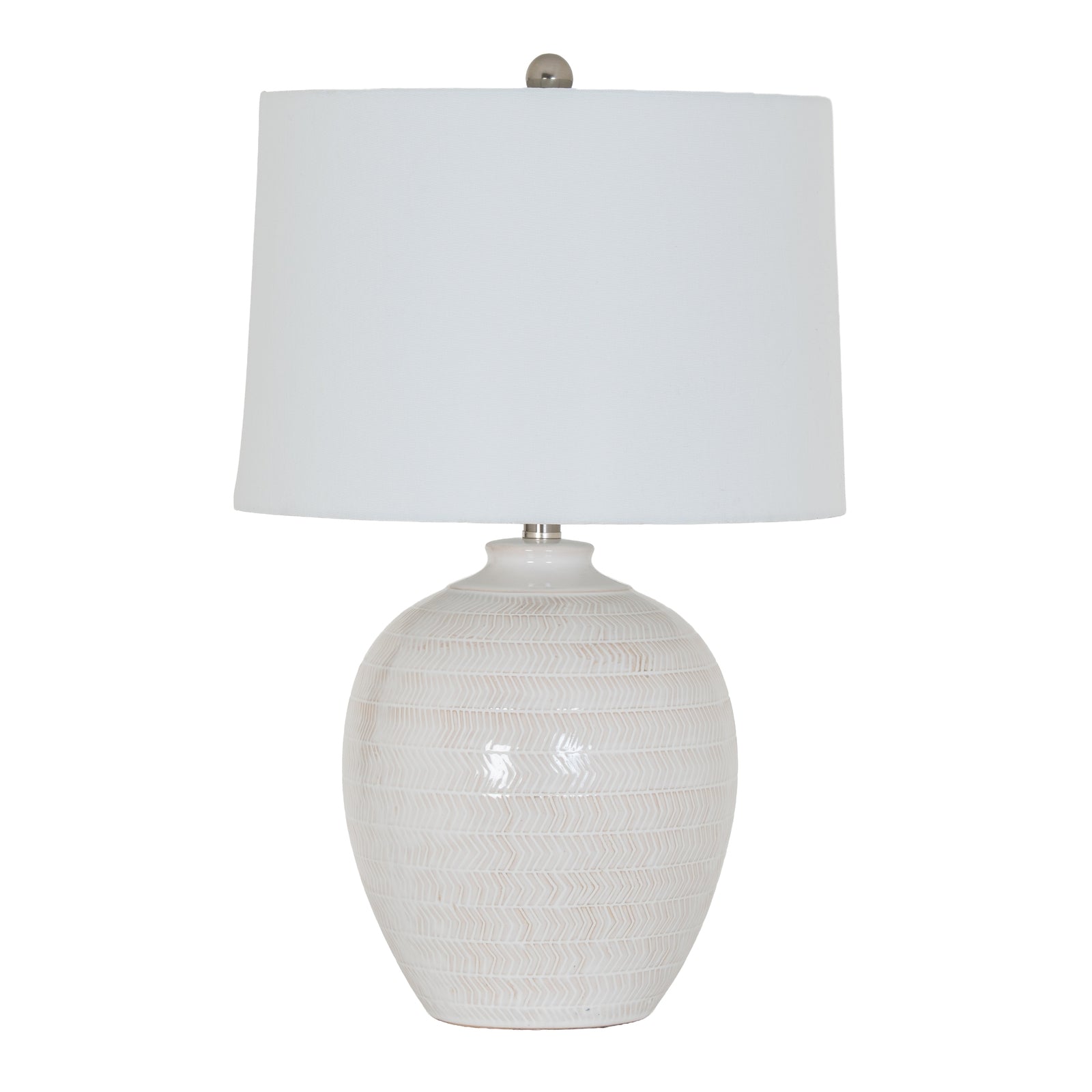 Table lamp with textured white base and white shade on a white background