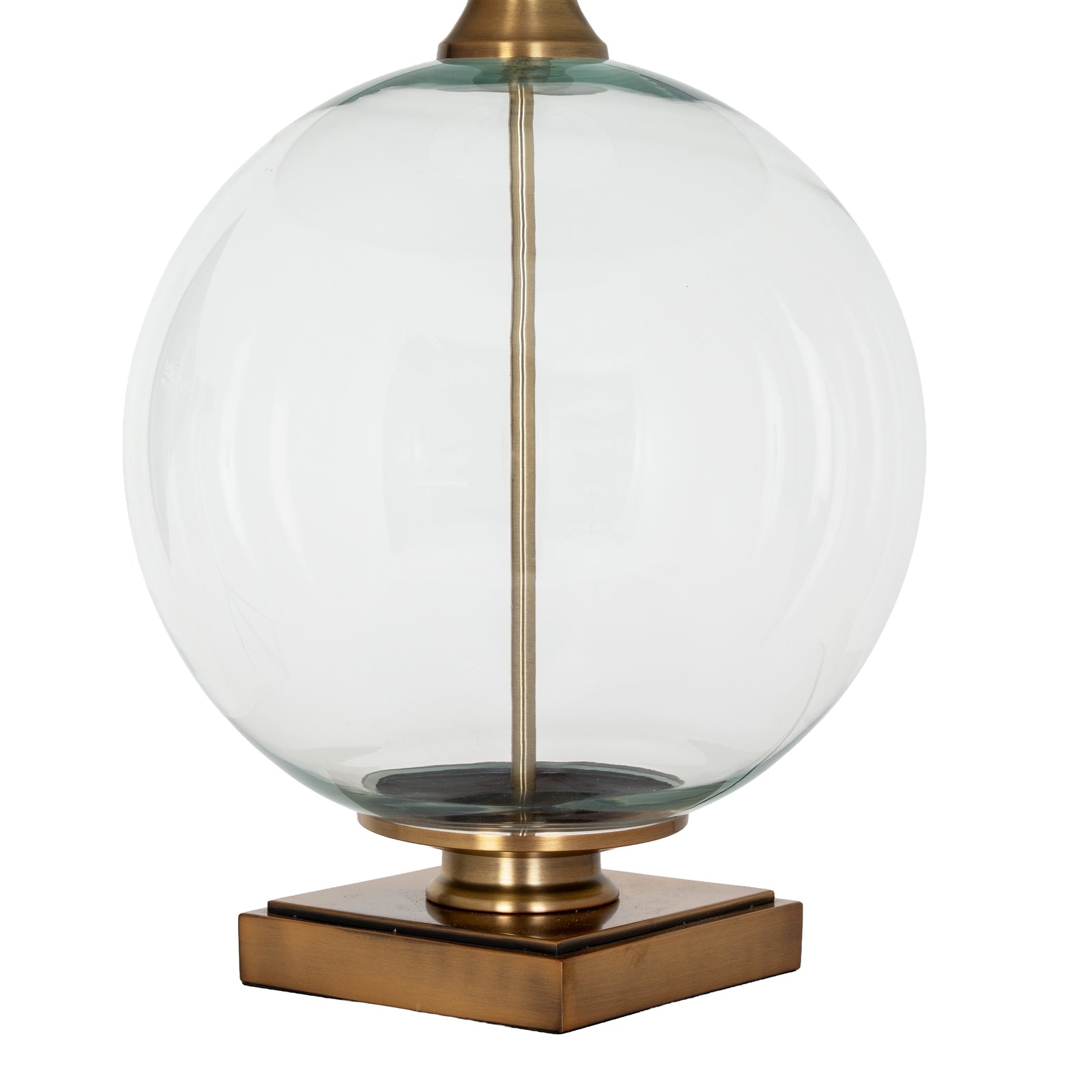 Decorative lamp with glass globe and brass base on a white background