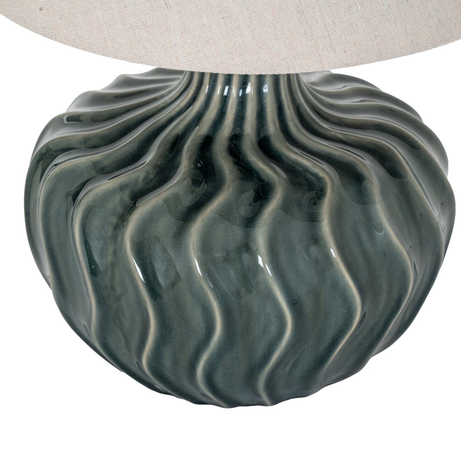 Decorative lamp base with wavy texture on a white background