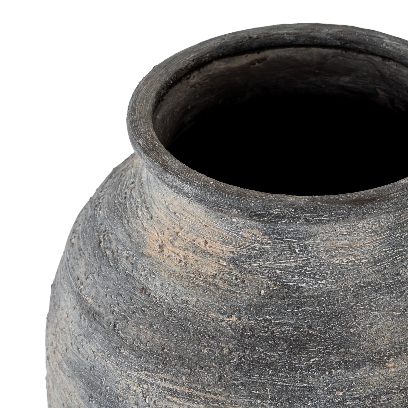 Close-up of a textured black pot on a white background