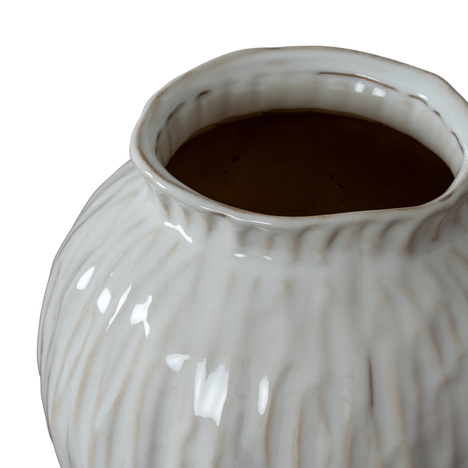White ceramic vase with textured surface on a white background