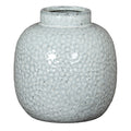 Speckled gray ceramic vase on a white background