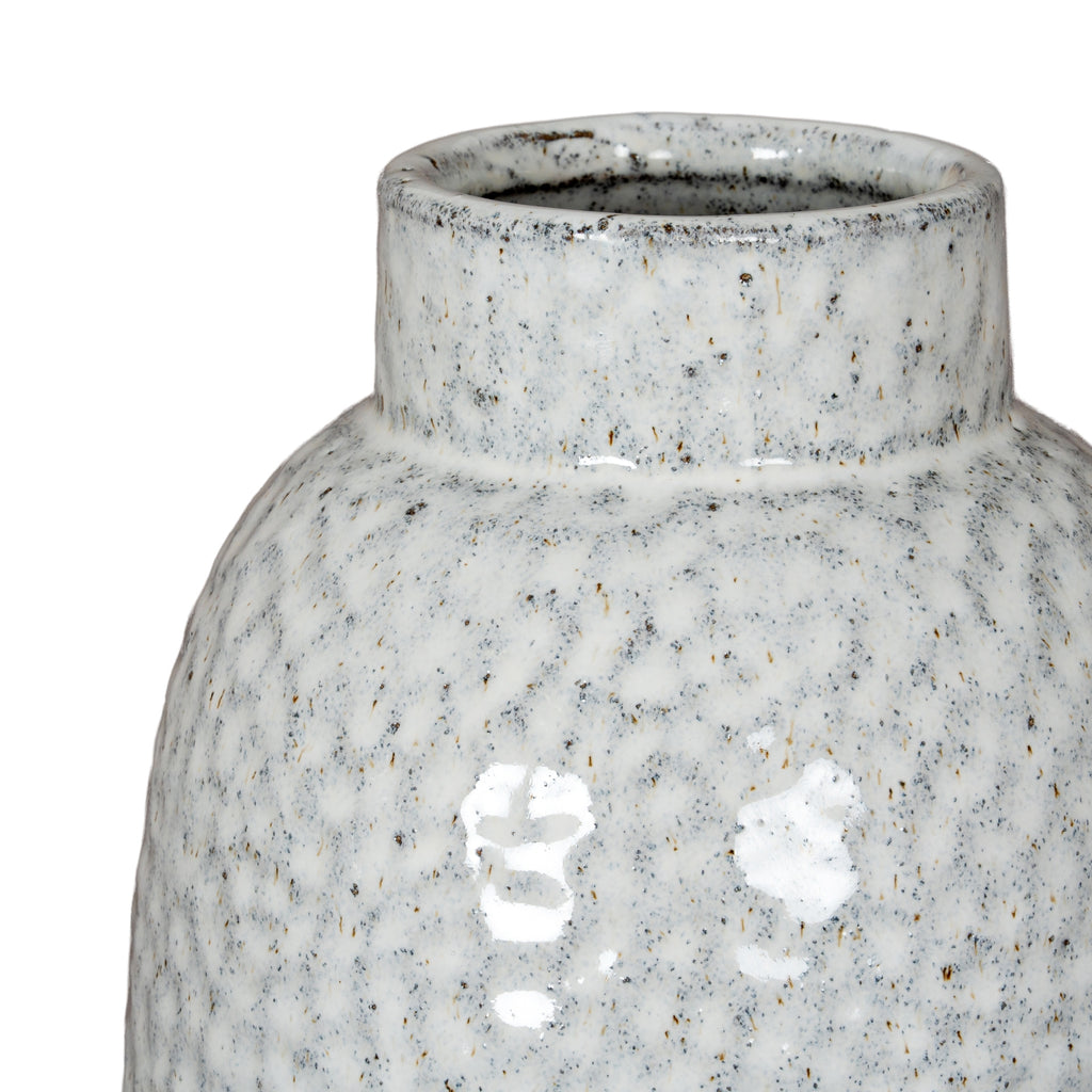 Speckled gray ceramic vase on a white background