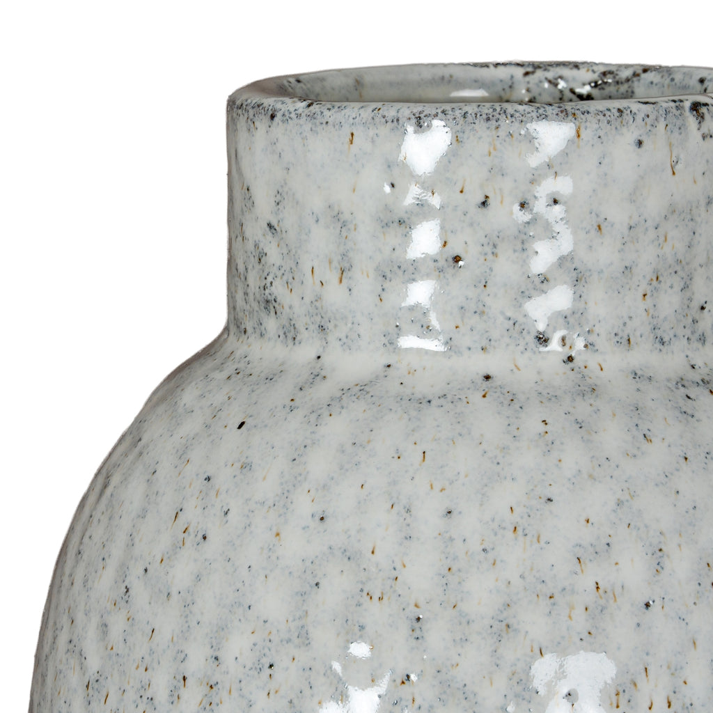 Close-up of a textured ceramic vase on a white background