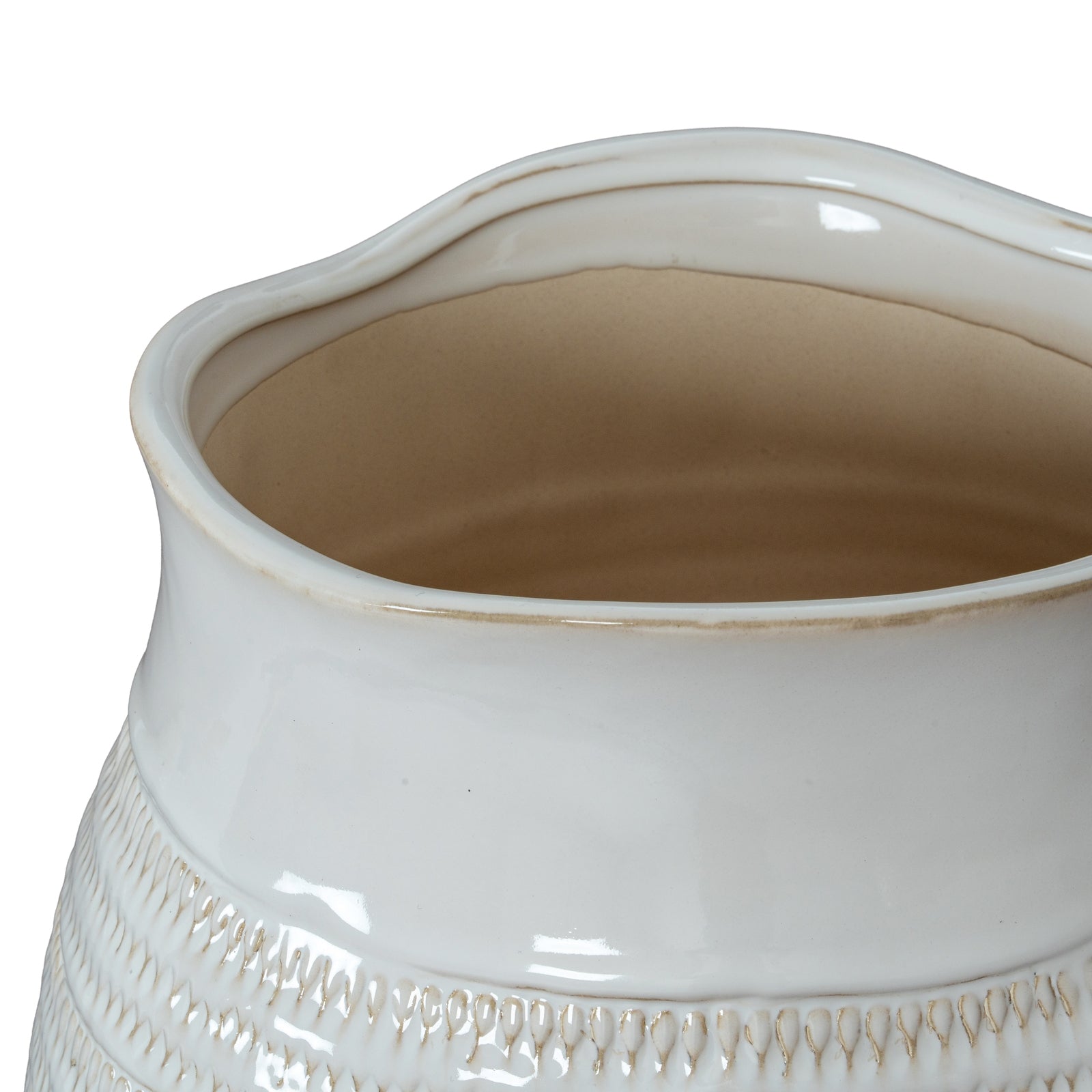 Close-up of a white ceramic vase with textured design on a white background