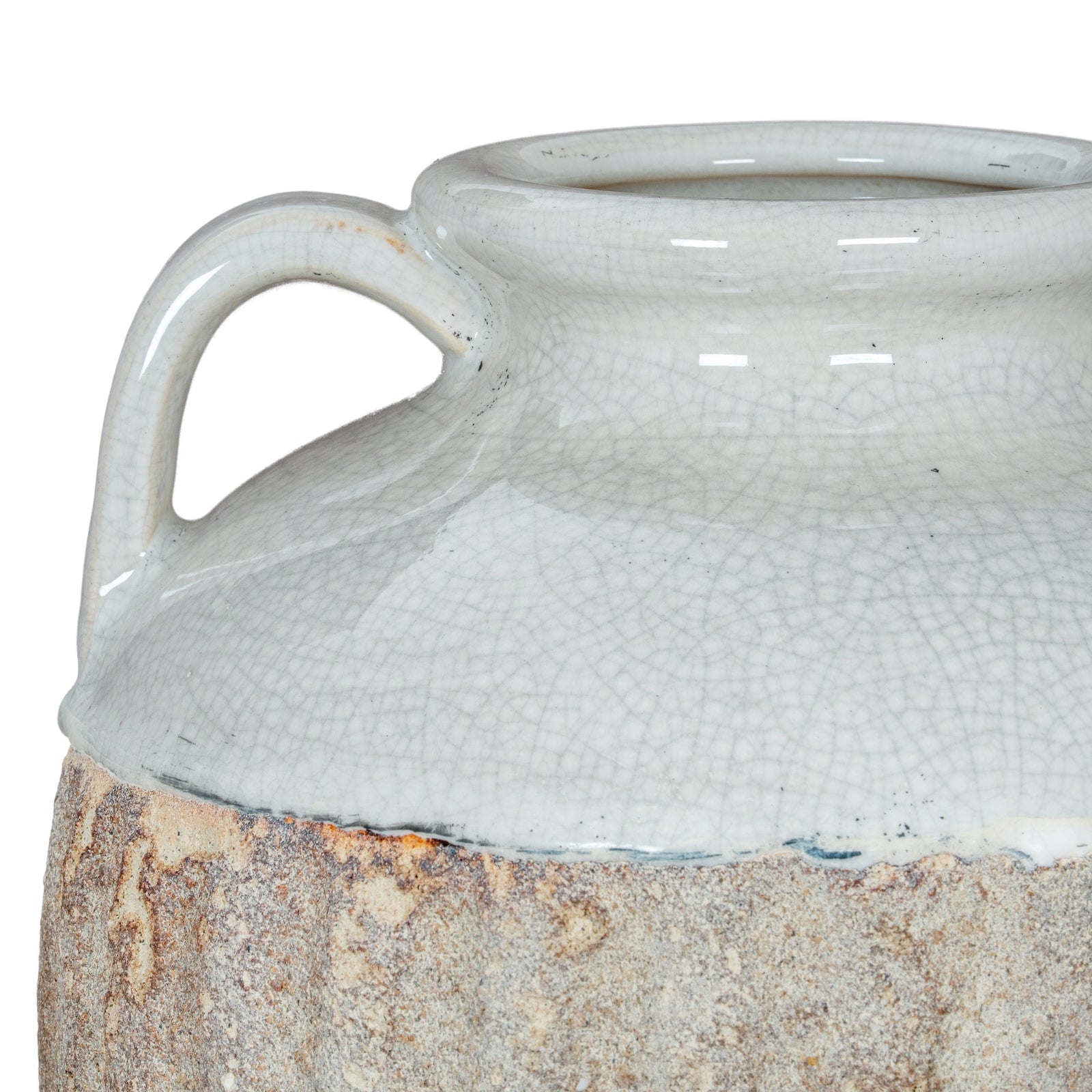 Close-up of a textured ceramic jar with a handle on a white background