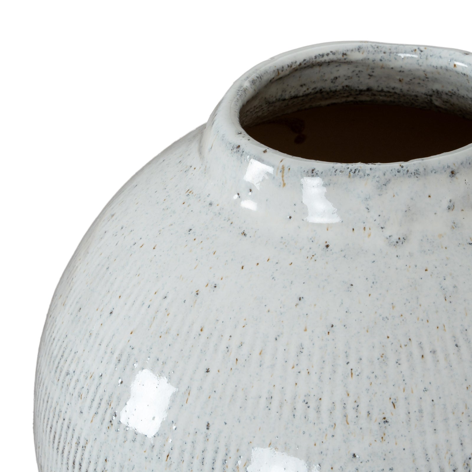 Close-up of a textured ceramic vase on a white background