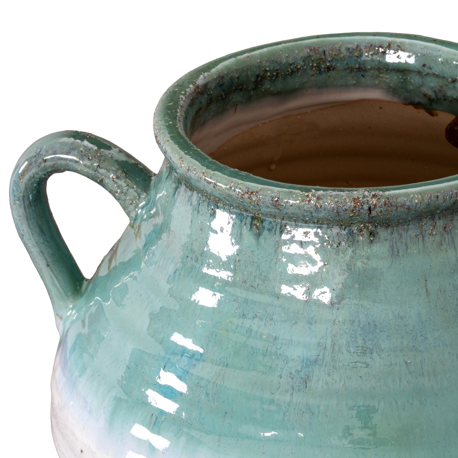 Close-up of a teal ceramic mug with a handle on a white background