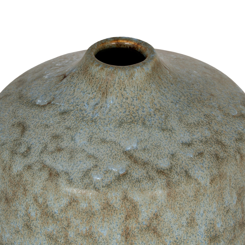 Close-up of a textured ceramic vase on a white background