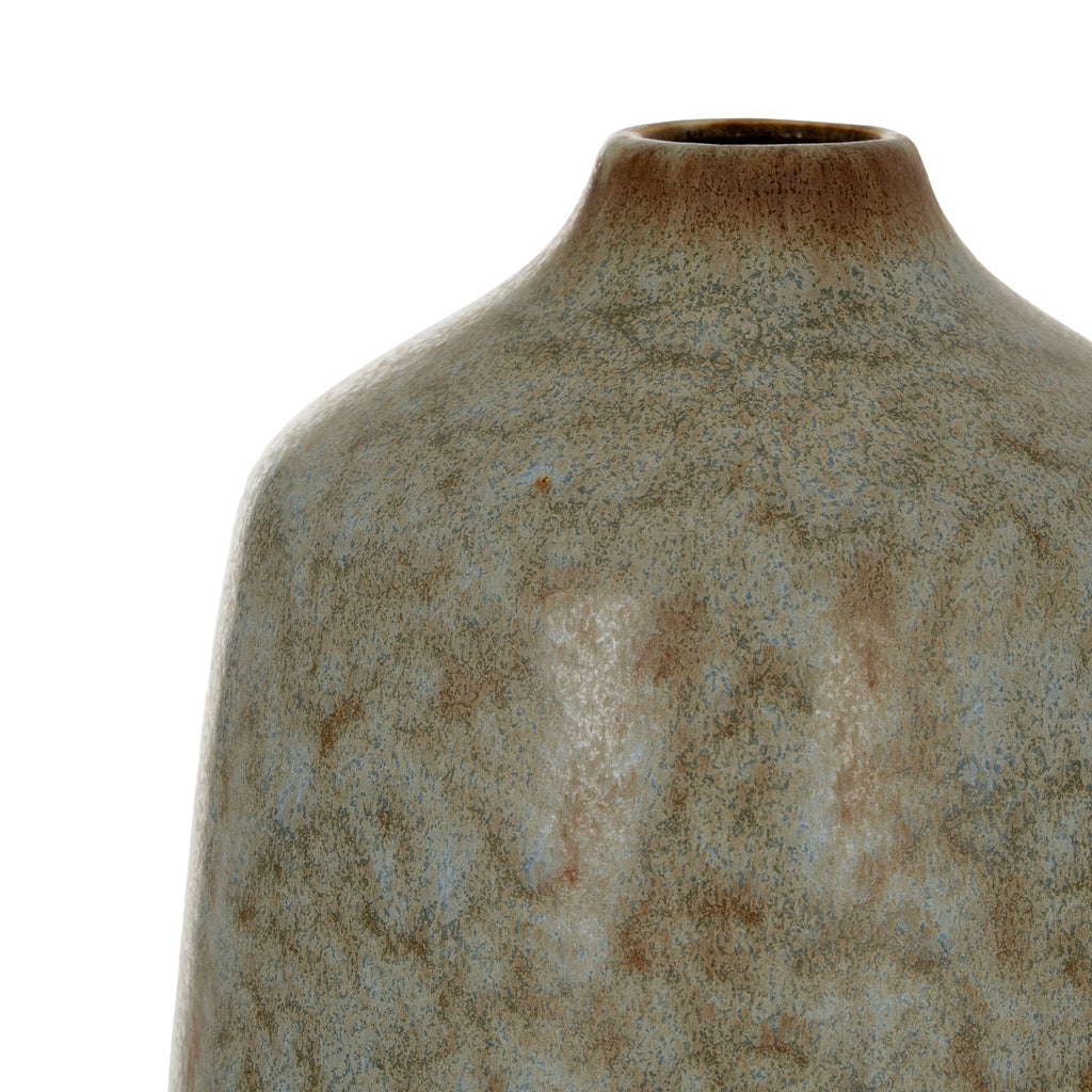 Close-up of a textured ceramic vase on a white background