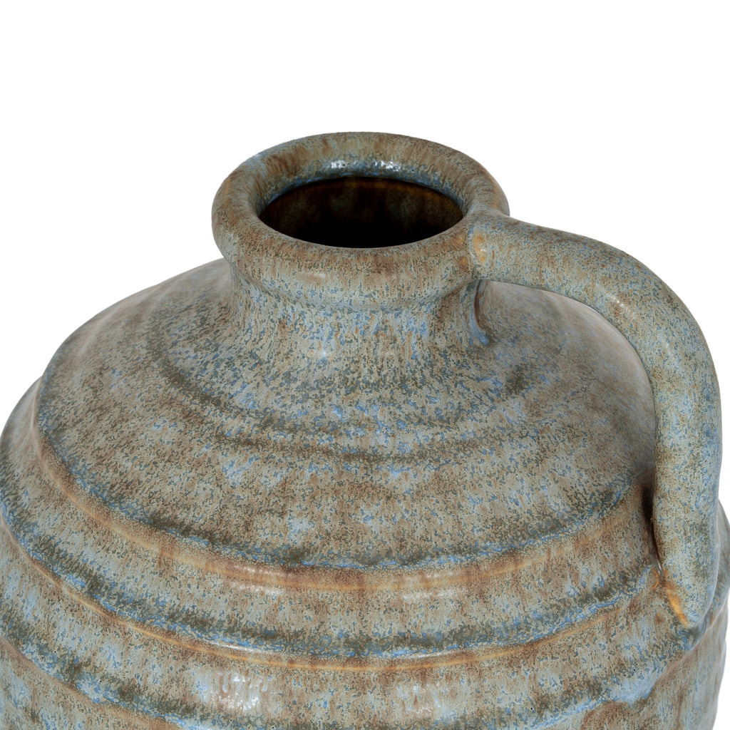 Vintage-style ceramic vase with a textured surface on a white background