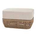 Wicker ottoman with a beige cushion on a white background