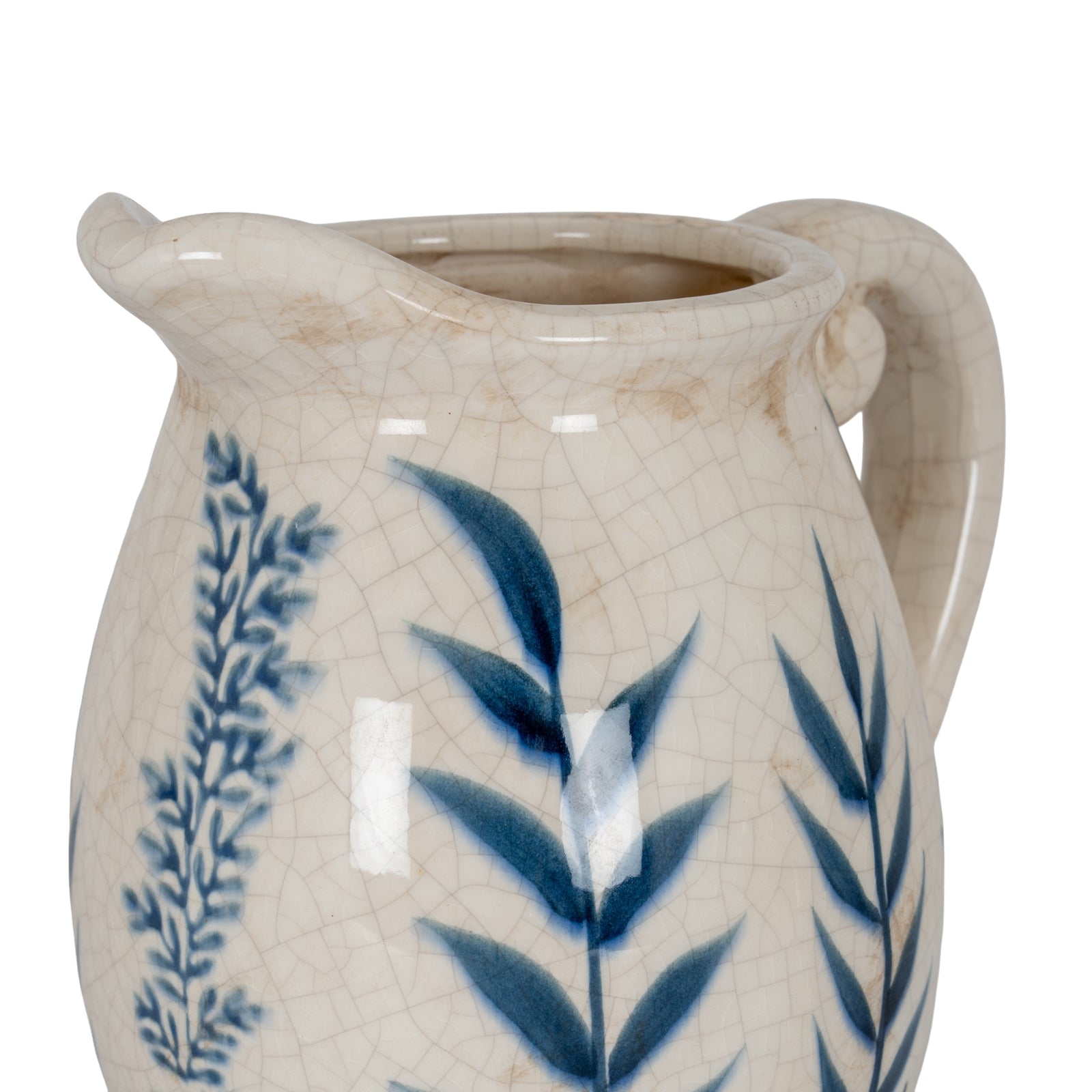 Ceramic pitcher with blue leaf patterns on a white background